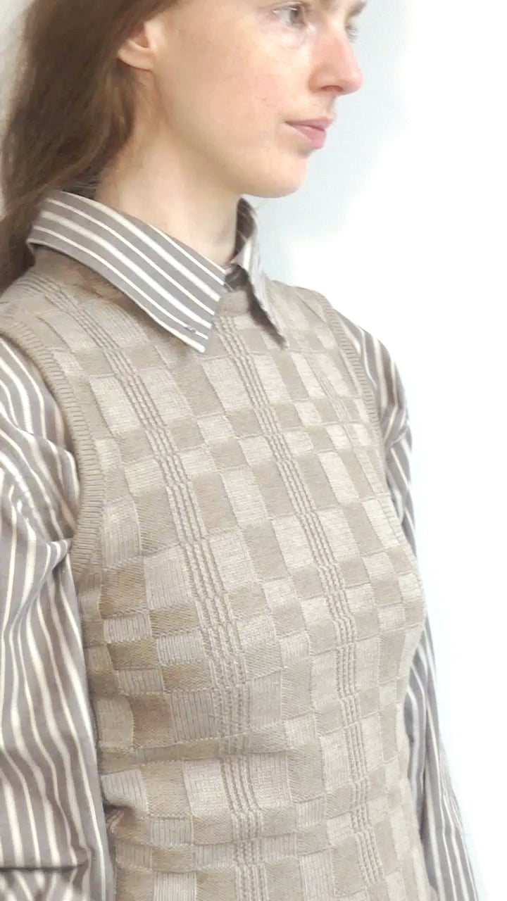 Model wearing Grid vest in beige & tan