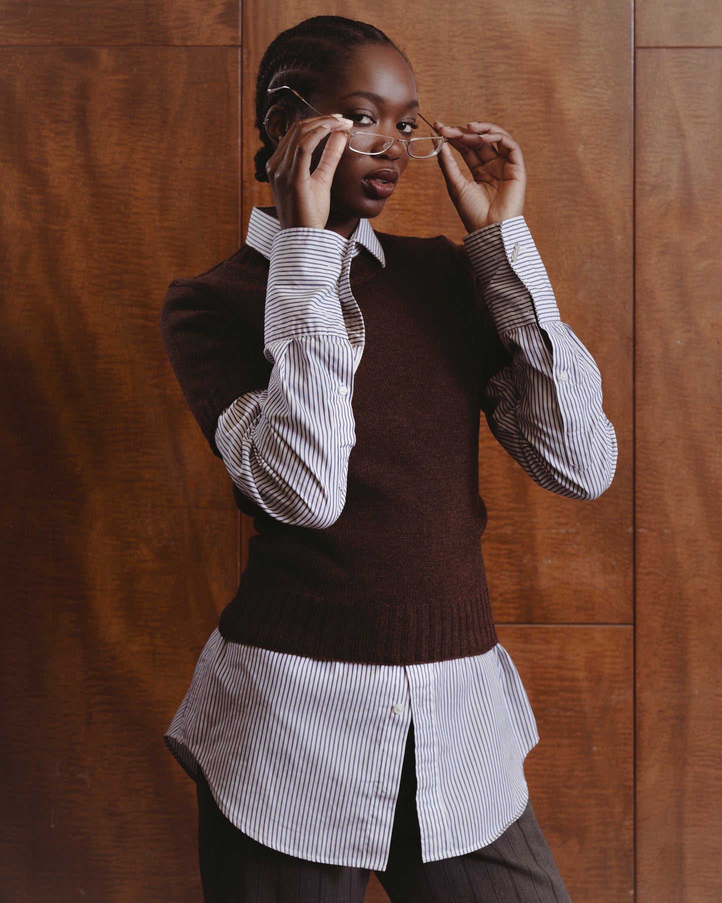 model wearing t-shirt sweater in chocolate brown over a long sleeve white shirt