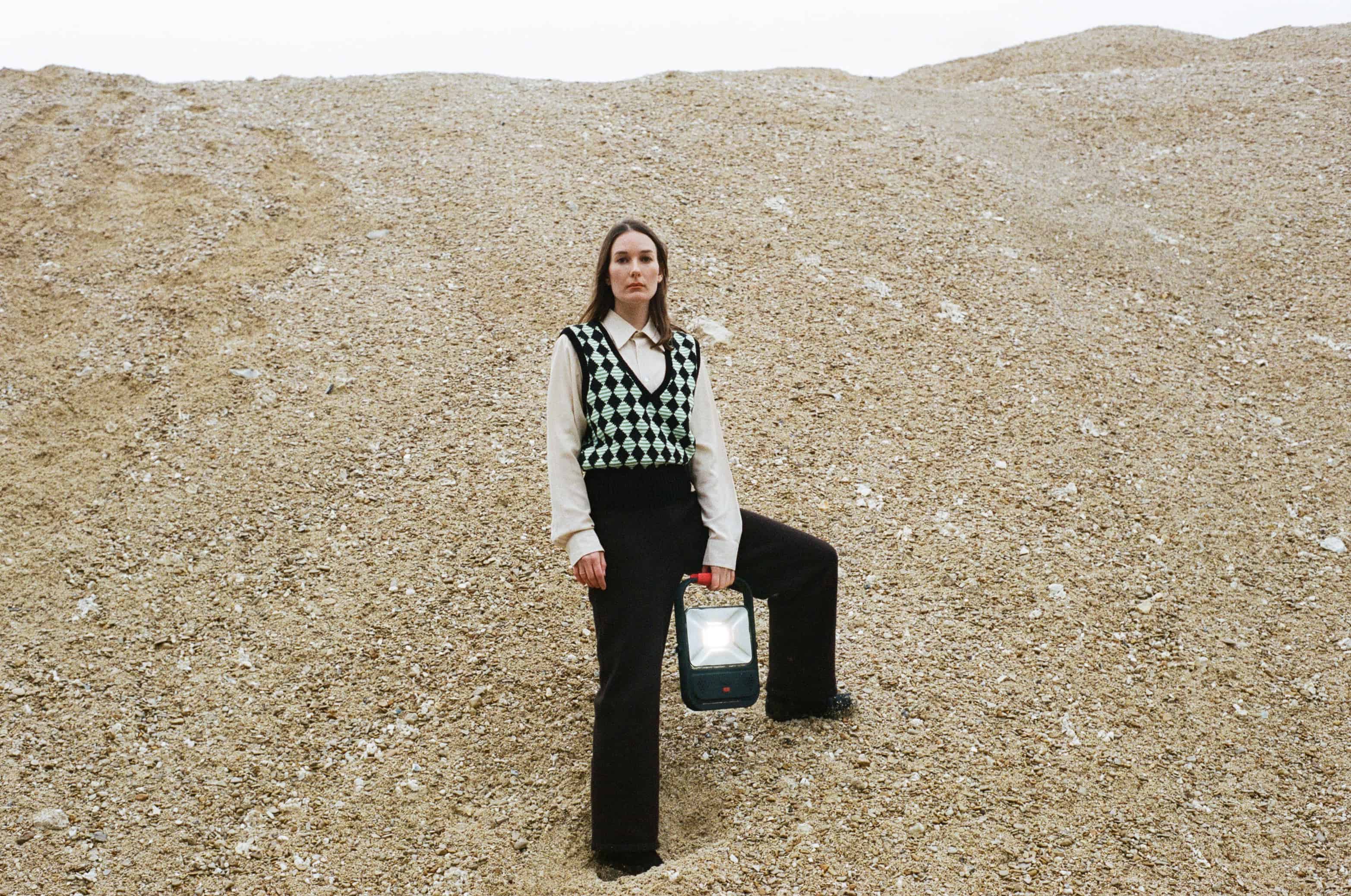 Model wearing  Diamond Vest over shirt and black trousers