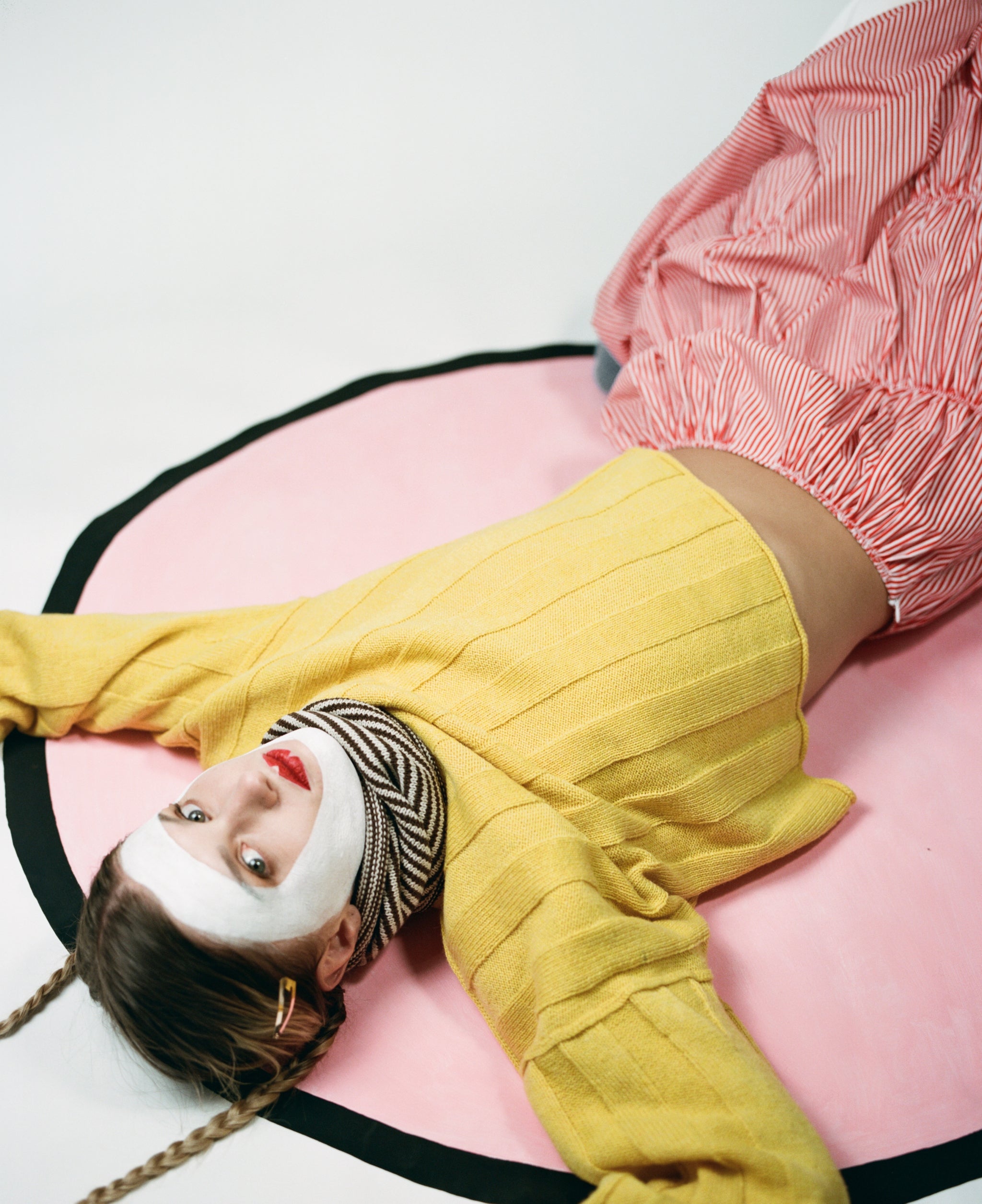 Model wearing stripy snood, wide-rib sweater in yellow, ruche cotton skirt in red & oatmeal