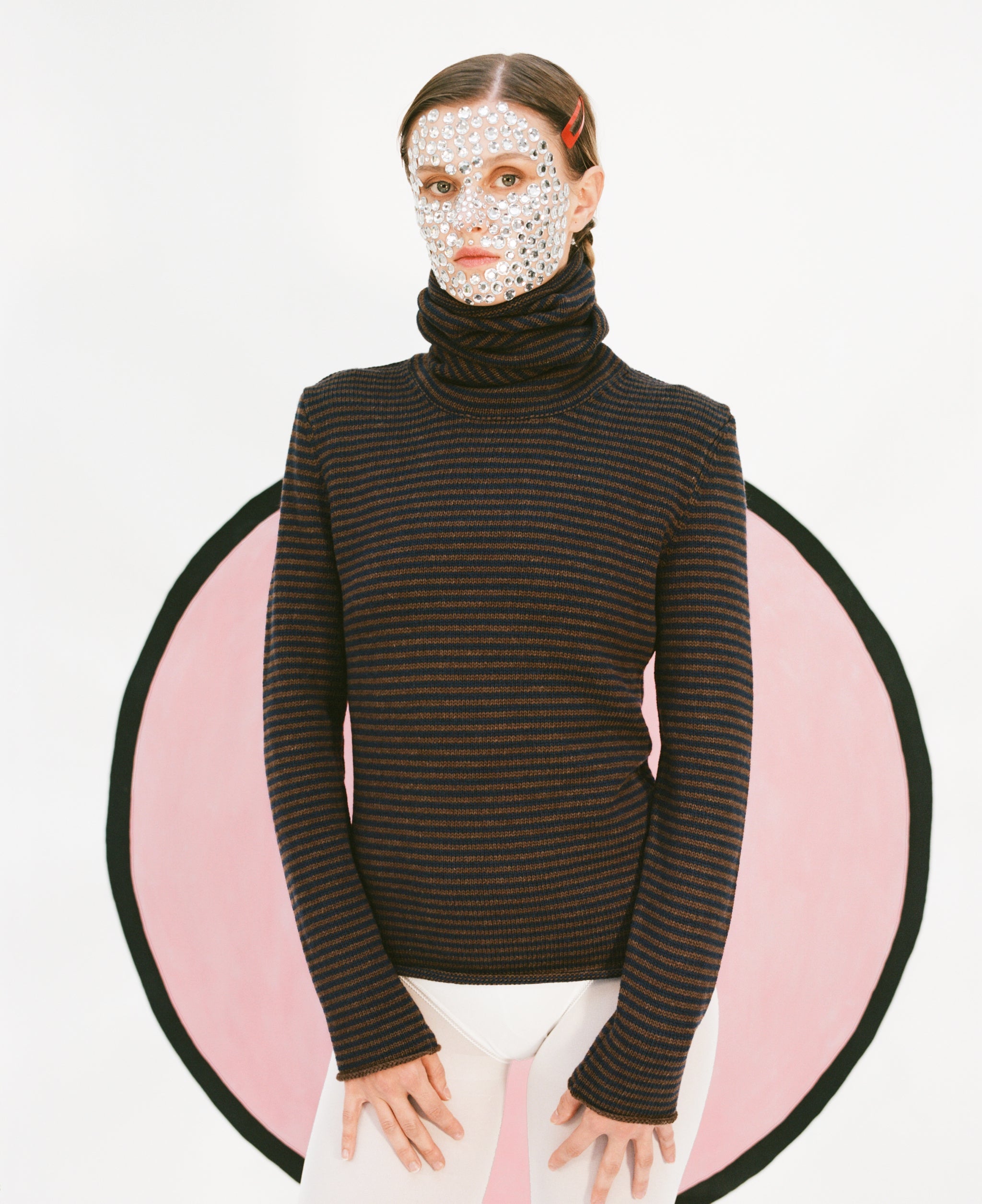 Close up of model wearing stripy snood top in navy & brown