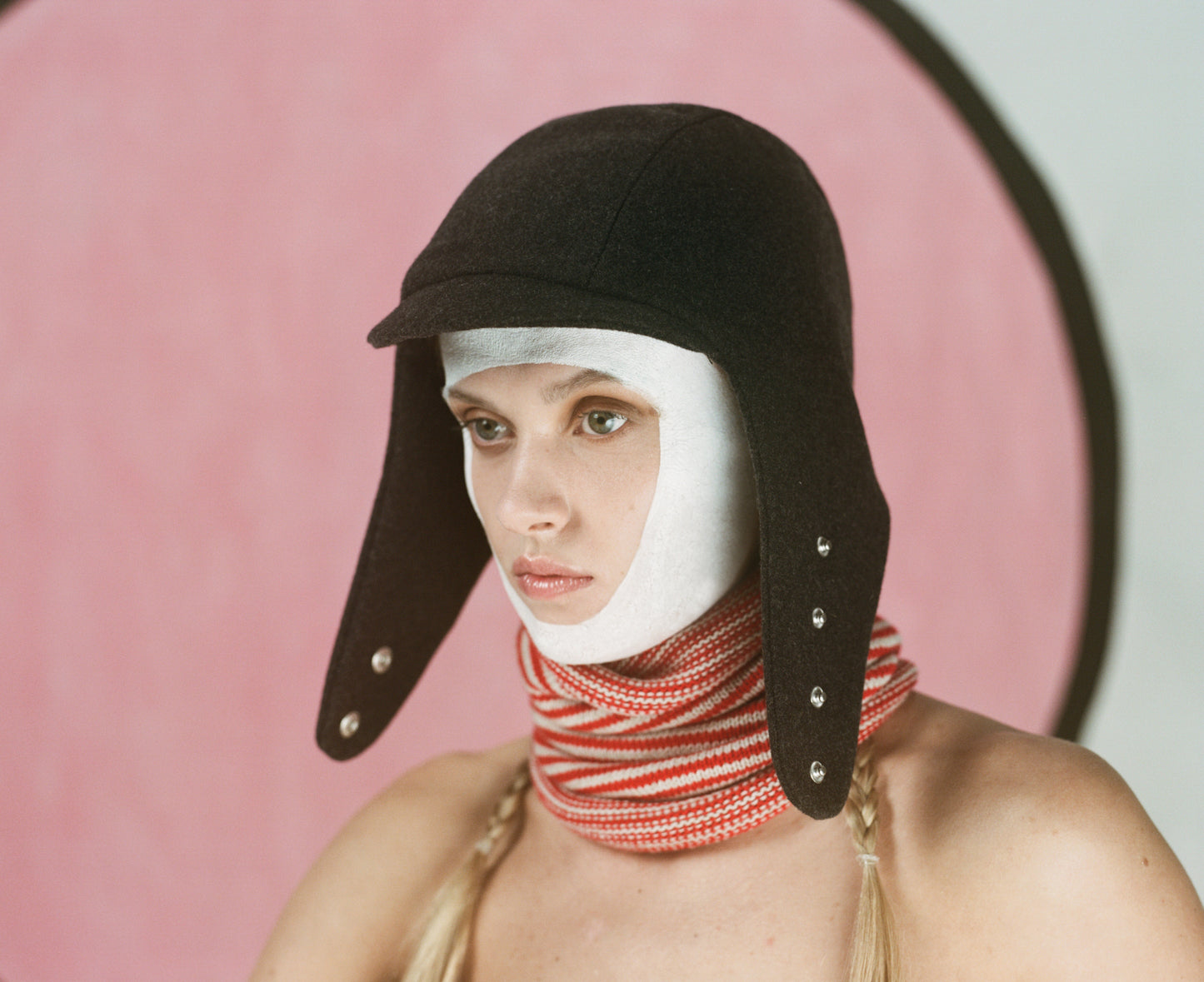 Model wearing flying hat in charcoal