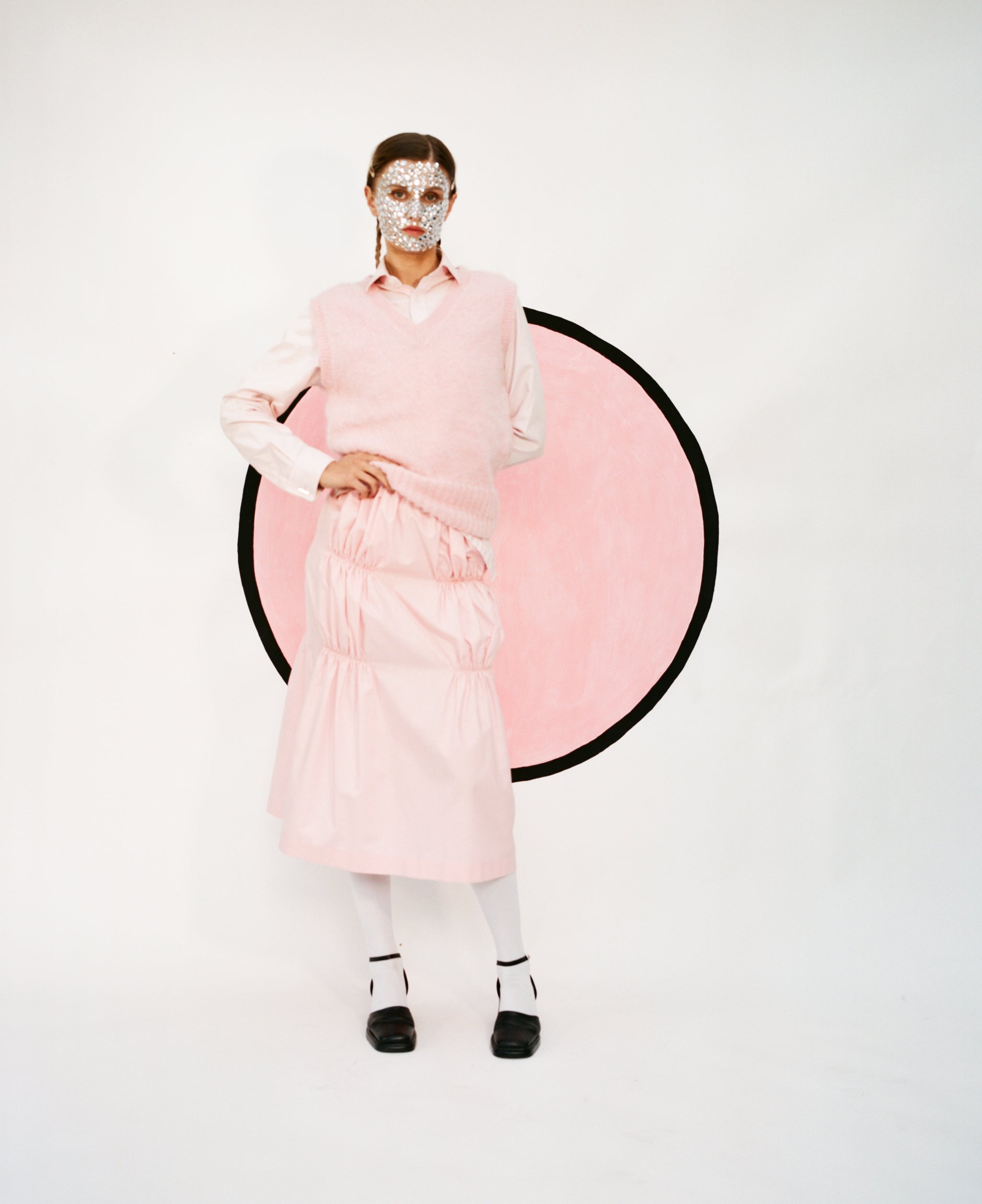 Model wearing full light pink outfit featuring the Ruche cotton skirt