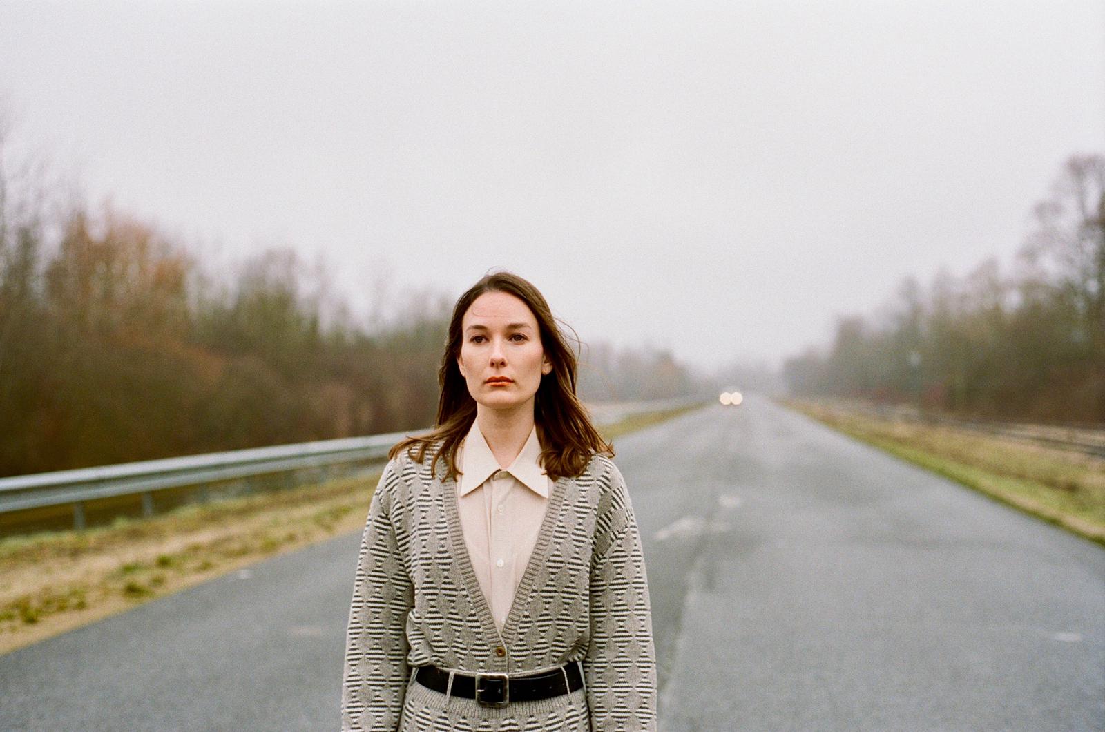 Model wearing knitted Diamond Suit over shirt and belt