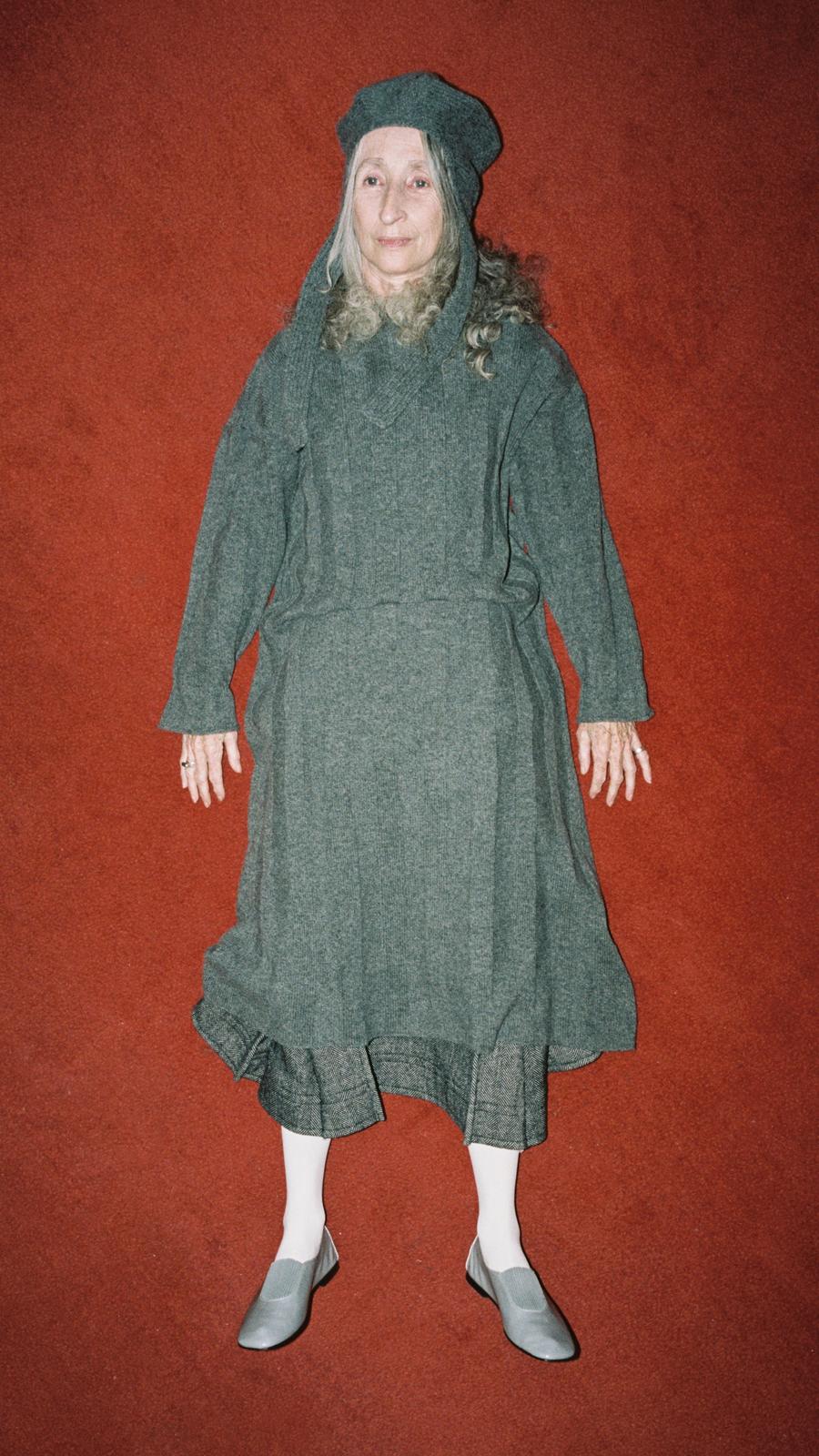 Look 17 - Model wearing classic hat in mid0grey, wide-rib robe in grey and Ankle Pleat Skirt in grey