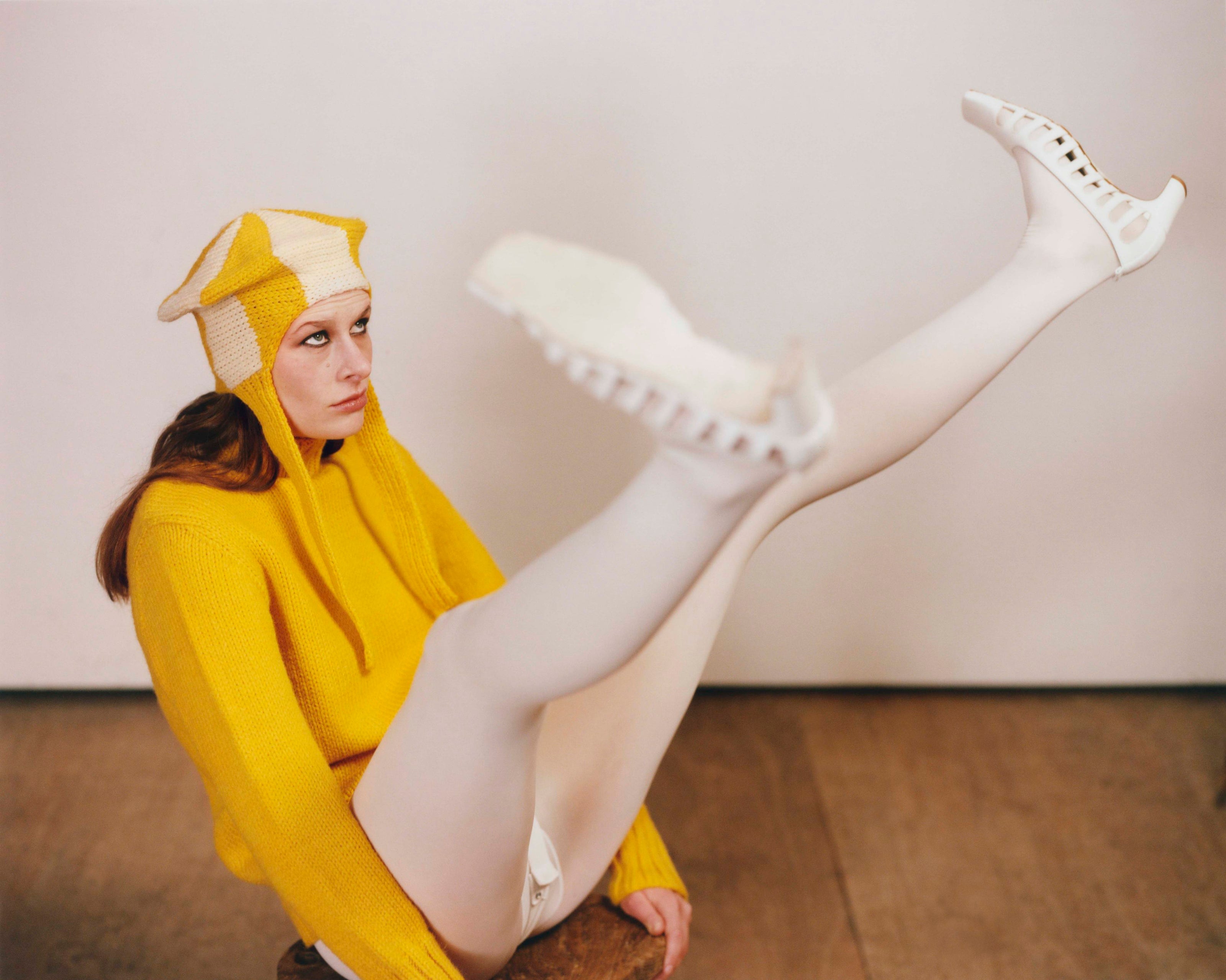 Model wearing yellow & ecru spiral classic hat and traditional sweater in yellow