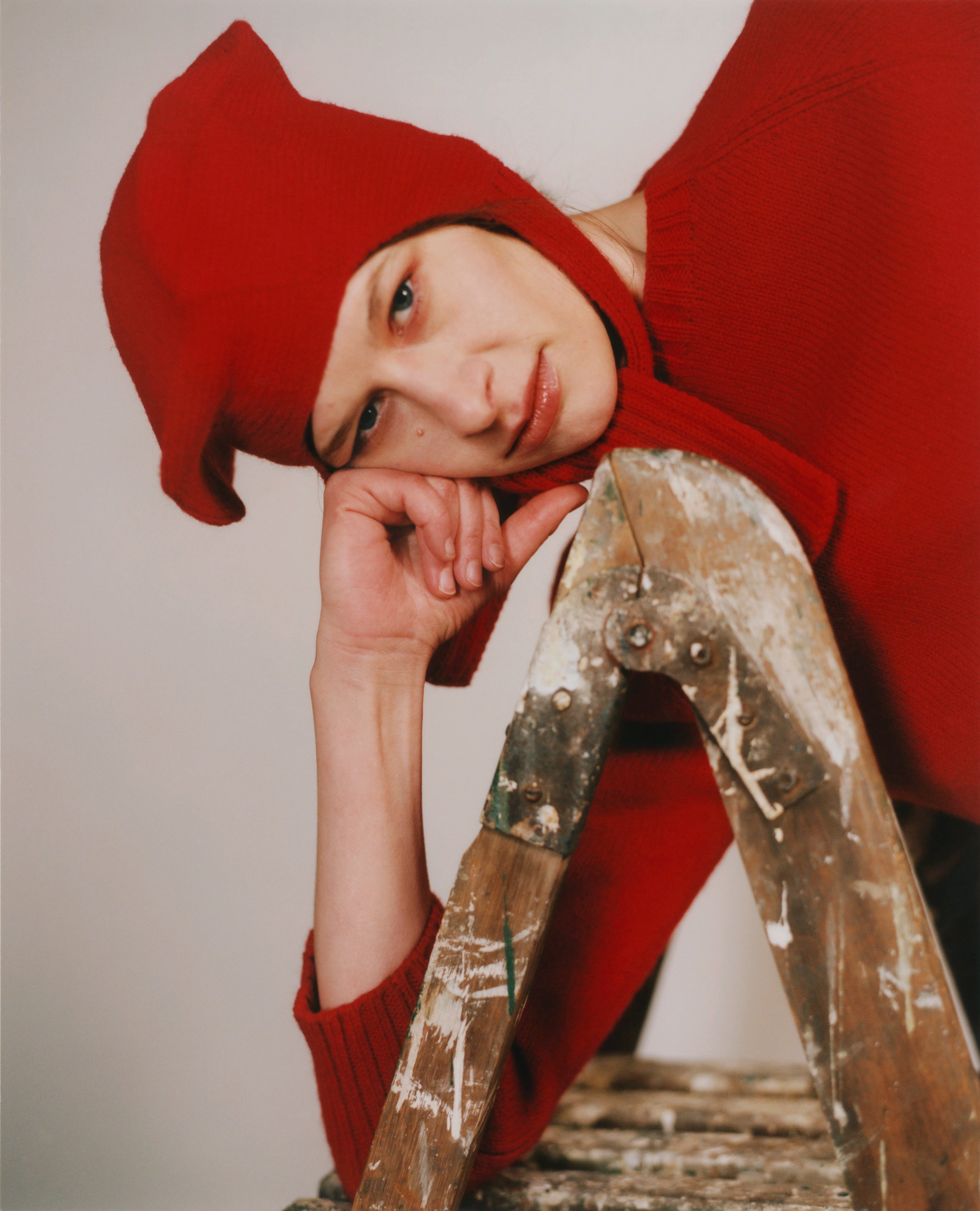 Model wearing classic hat in red
